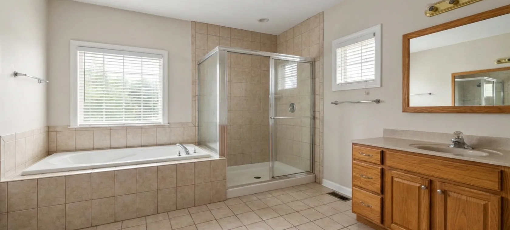 Bathroom remodeling Los Angeles outdated bathroom with beige tile tub and old vanity